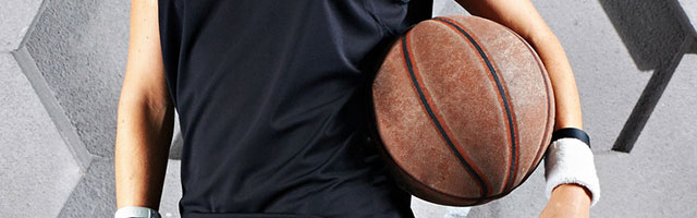 girl holding basketball